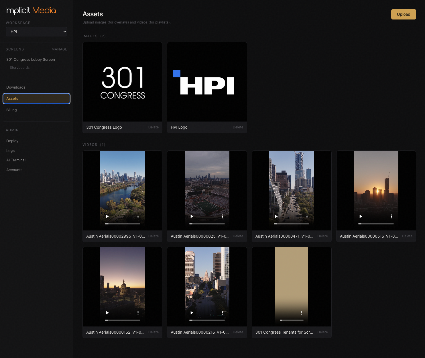 Asset library showing uploaded video clips and brand logos